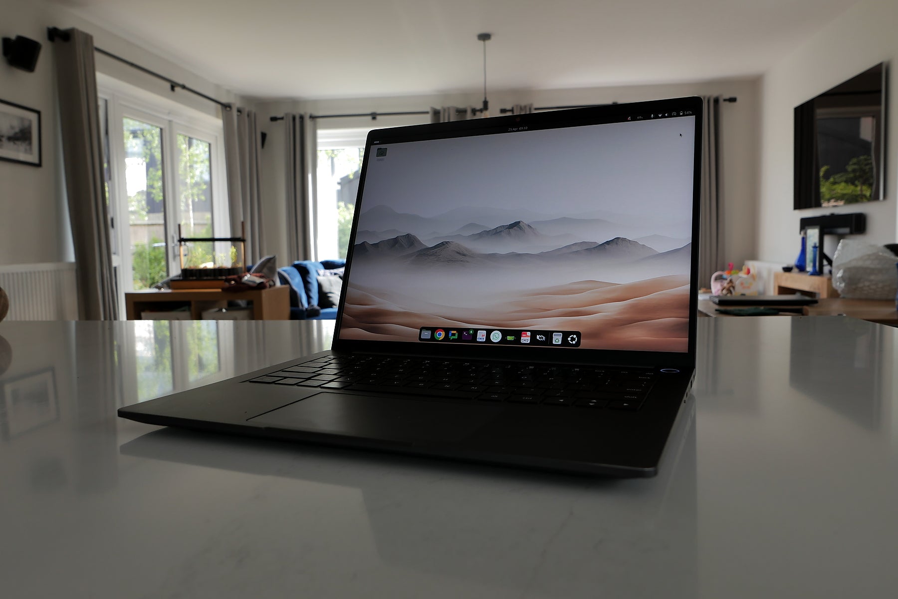 StarBook Horizon laptop on a softly blurred interior backdrop